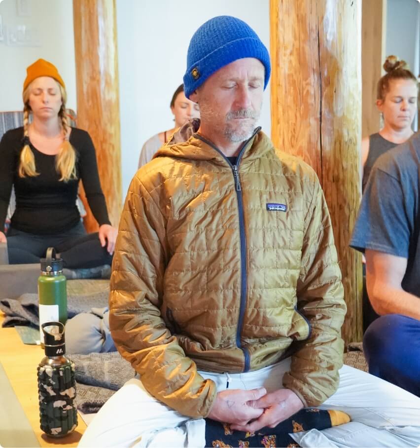 A man sitting in meditation focusing on his breathing