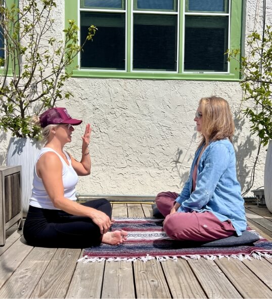 Two students working together at our Breath School teacher training retreat in San Diego